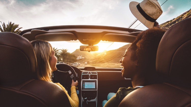 Two women driving a car